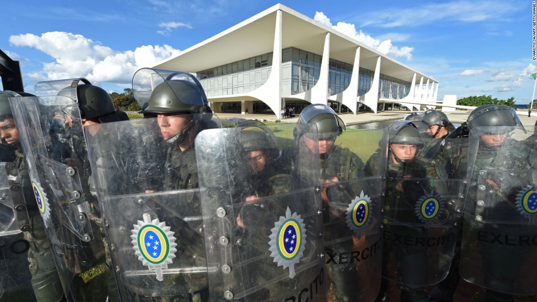 Soldiers in riot gear block the presidential palace on March 16. 