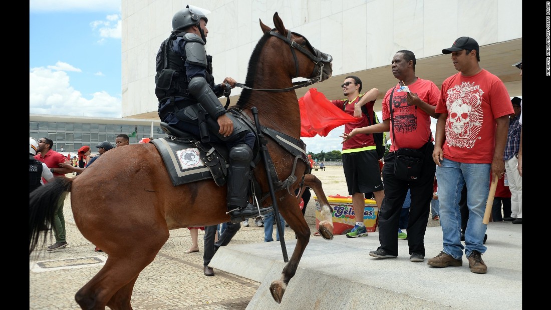 Demonstrators gather next to the presidential palace in Brasilia on Thursday, March 17.