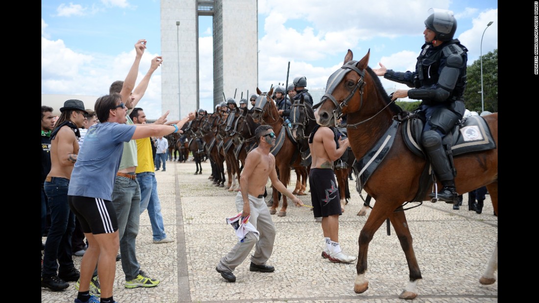 Protesters face off with police in Brasilia on March 17.