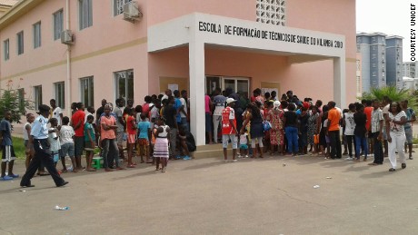 People gather for shots at a vaccination post during the campaign against yellow fever in the Kilamba neighborhood in Luanda, Angola.