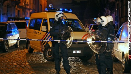 Belgian police forces stand guard in a street during a police action in the Molenbeek-Saint-Jean district in Brussels, on March 18, 2016. 
Belgian police arrested five people in counter-terror raids in Brussels on March 18, including Paris attacks suspect Salah Abdeslam and the family who sheltered him, prosecutors said. Special federal police forces arrested Abdeslam, who has been on the run since the deadly November 13 attacks, wounding him lightly in the leg during an afternoon raid in the capital&#39;s gritty immigrant neighbourhood of Molenbeek. / AFP / BELGA / NICOLAS MAETERLINCK        (Photo credit should read NICOLAS MAETERLINCK/AFP/Getty Images)