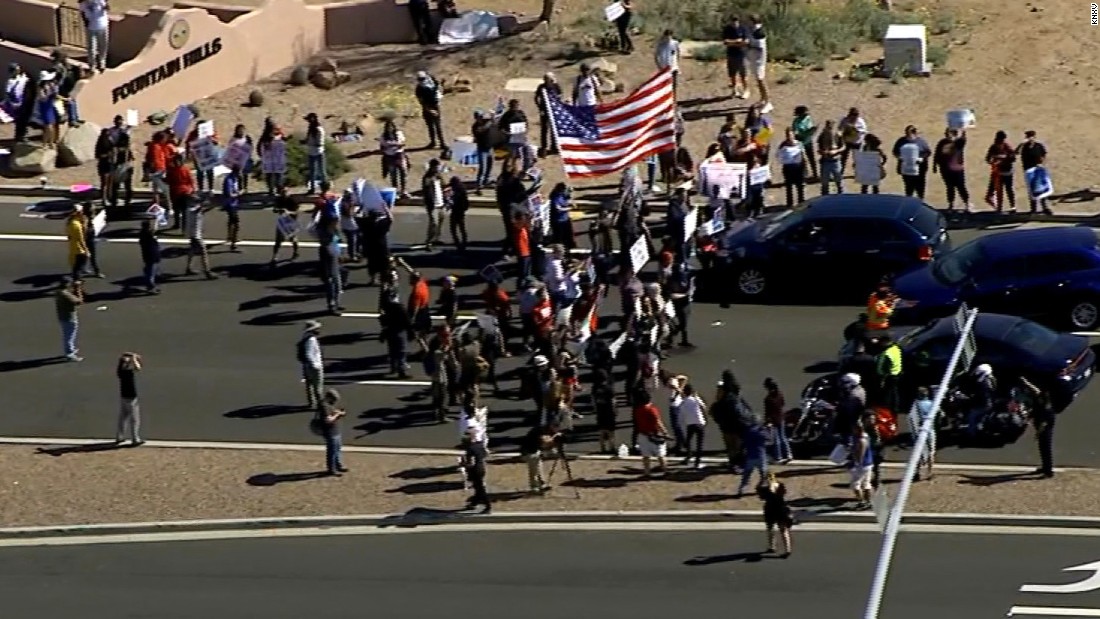 Protesters block road outside Trump Arizona event, march in NYC