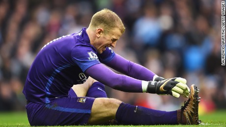 Manchester City and England goalkeeper Joe Hart winces in pain after injuring his calf and being stretchered off at the Etihad Stadium.