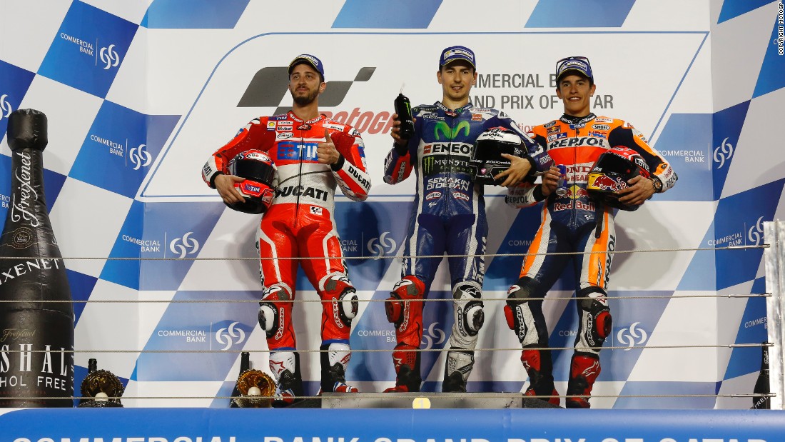 Yamaha&#39;s Jorge Lorenzo stands proudly atop the Qatar podium after his victory in this season&#39;s inaugural Grand Prix. Andrea Dovizioso of Ducati claimed second, while Marc Marquez of Honda seized third. 