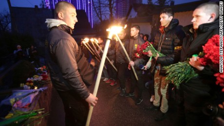 Servicemen of Azov, a Ukrainian volunteer battalion, hold torches during a tribute ceremony at the Belgian embassy in Kiev on March 22.