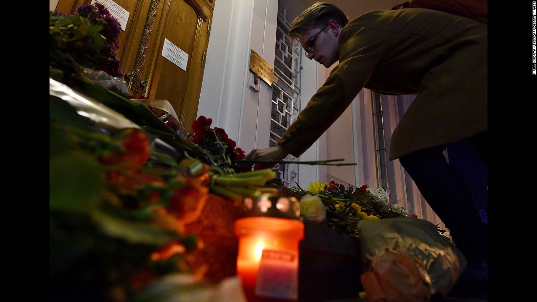 A man places flowers outside the Belgian Embassy in Moscow on March 22.