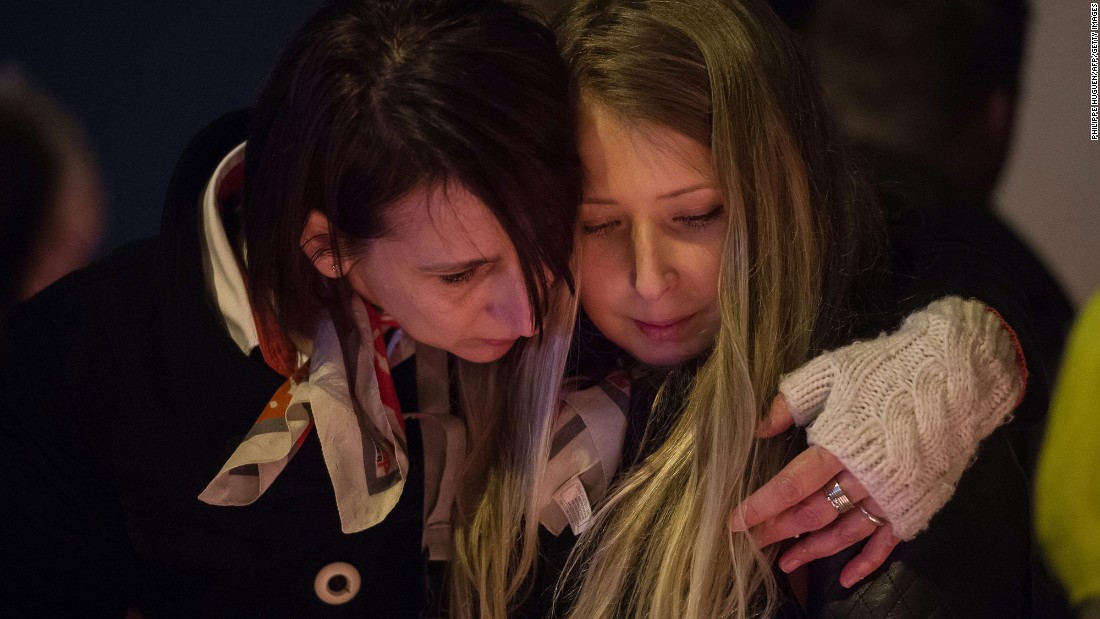 Airport workers and their relatives in Brussels, Belgium, hold a candlelight vigil Wednesday, March 23, to pay tribute to those who were killed in &lt;a href=&quot;http://www.cnn.com/2016/03/22/world/gallery/belgium-airport-explosion/index.html&quot; target=&quot;_blank&quot;&gt;terrorist attacks &lt;/a&gt;the day before. On Tuesday, explosions rocked the city&#39;s airport and a subway station.