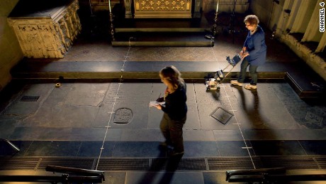 Archaeologists used radar scans to perform a non-invasive survey of William Shakespeare&#39;s grave. It is the smaller square stone to the right of the yellow tape measure lying on the floor.