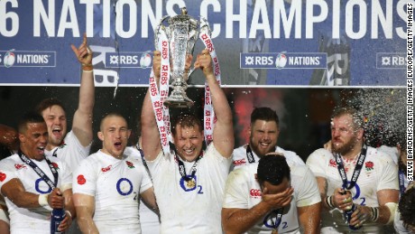 England captain Dylan Hartley lifts the Six Nations trophy at Stade de France.