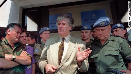 PALE, BOSNIA AND HERZEGOVINA:  Radovan Karadzic (C), Bosnian Serb warlord and leader of the Serb-run part of Bosnia during the 1992-1995 war, addresses media 05 August 1993 in his stronghold of Pale, while Ratko Mladic (L), his military commander, and UN High Commander for Bosnia, Belgian General Francis Briquemont (R) look on. Karadzic and Mladic, both at large, are indicted by the International Criminal Tribunal for the former Yugoslavia (ICTY) in The Hague for war crimes and genocide committed during Bosnia&#39;s war. AFP PHOTO (Photo credit should read Michael Evstafiev/AFP/Getty Images)