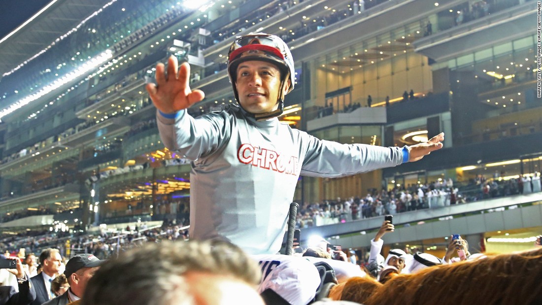 Victor Espinoza celebrates after riding California Chrome to victory in the Dubai World Cup to land the $6 million top prize.  