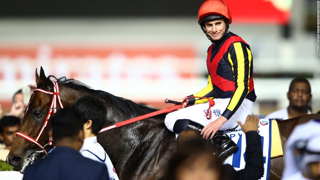 Jockey Ryan Moore celebrates after riding Real Steel to victory in the Dubai Turf at the $30 million World Cup meet. 