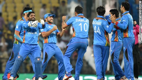 Afghanistan&#39;s players celebrate a historic victory after a six-run win over West Indies in Nagpur in the World Twenty20 tournament. 