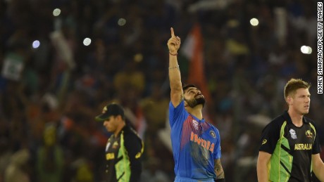 Every picture tells a story: Virat Kohli points to the heavens after guiding India to its crucial group victory over Australia in the Twenty20 World Cup. 