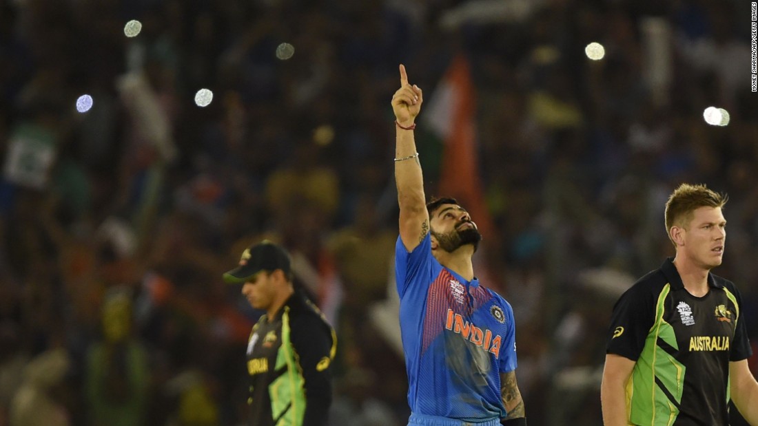 Virat Kohli points to the heavens after guiding India to its crucial group victory over Australia in the Twenty20 World Cup. 