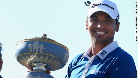 Jason Day holds the Walter Hagen Cup after beating Louis Oosthuizen at the WGC Dell Match Play.
