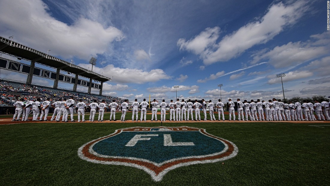 Members of the New York Yankees line up for the national anthem prior to the start of a game in Tampa, Florida, on March 2.