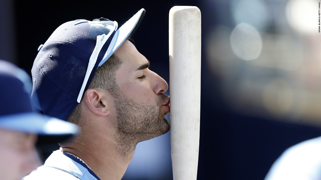 Tampa Bay&#39;s Kevin Kiermaier kisses his bat in the dugout during a game in Port Charlotte, Florida, on March 9.