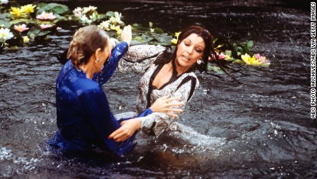 UNITED STATES - APRIL 13:  DYNASTY - &quot;The Threat&quot; - Season Three - 4/13/83, Krystle (Linda Evans) and Alexis&#39;s (Joan Collins) argument about Fallon resulted in a brawl in the Carrington lily pond.,  (Photo by ABC Photo Archives/ABC via Getty Images)