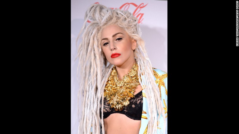 Lady Gaga is pictured attending the 2013 Jingle Bell Ball in London wearing a dreadlock style.