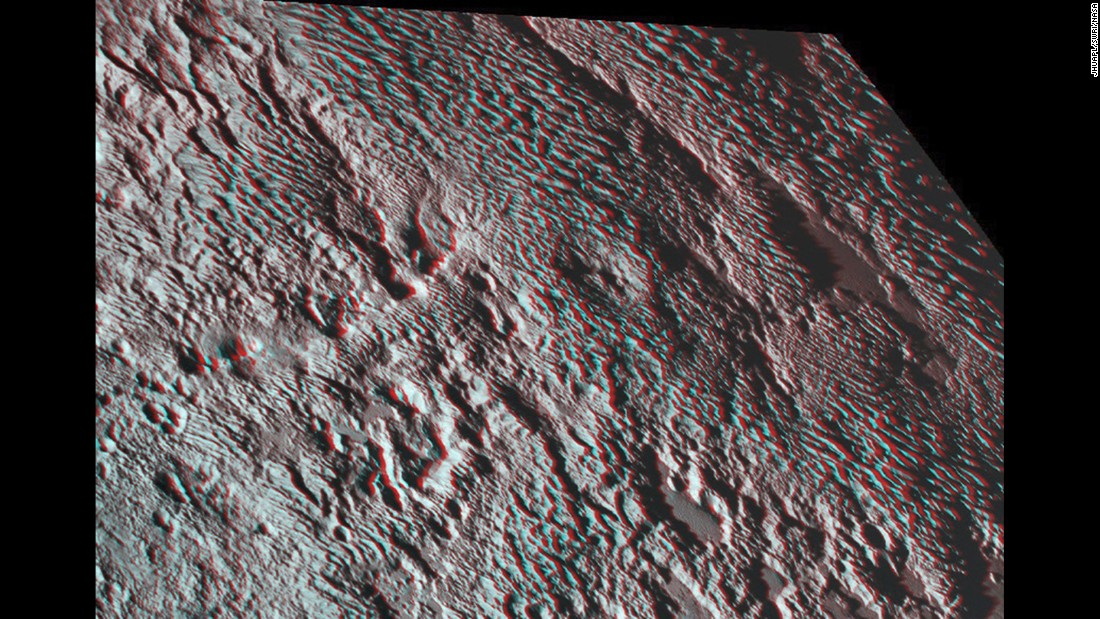 New Horizons photographed what scientists are calling &quot;bladed&quot; terrain near the heart-shaped region of the dwarf planet. This 3-D image was created using two images taken about 14 minutes apart on July 14. The first image was snapped about 16,000 miles (25,000 kilometers) from Pluto and the second was taken when the spacecraft was 10,000 miles (about 17,000 kilometers) away. Break out your 3-D glasses for the best view.