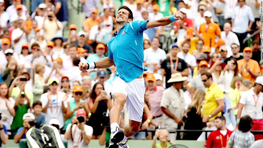 Novak Djokovic celebrates victory against Kei Nishikori of Japan in the final of the 2016 Miami Open.