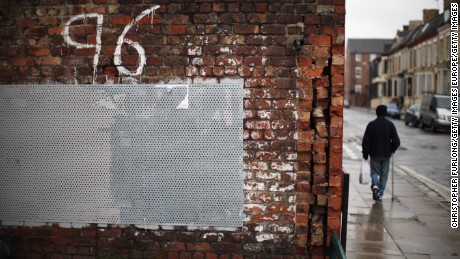 LIVERPOOL, UNITED KINGDOM - DECEMBER 19:  A man walks past Justice for the 96 graffiti outside Liverpool Football Club as the High Court quashes the &#39;Accidental Death&#39; verdict on December 19, 2012 in Liverpool, England. An application presented by the Attorney General, Dominic Grieve to Lord Chief Justice Lord Judge has resulted in the quashing of the original accidental death verdict and an order for fresh inquests. The Hillsborough disaster occurred during the FA Cup semi-final tie between Liverpool and Nottingham Forest football clubs in April 1989 at the Hillsborough Stadium in Sheffield, which resulted in the deaths of 96 football fans.  (Photo by Christopher Furlong/Getty Images)