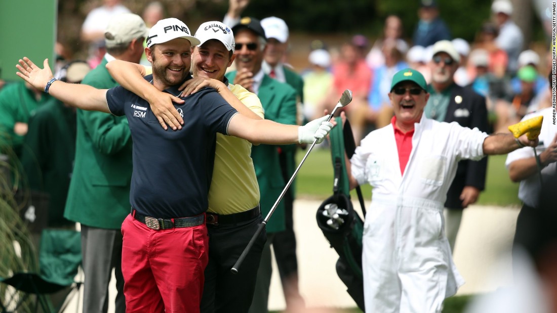 Englishman Andy Sullivan gets a warm Argentinian embrace from Emiliano Grillo after hitting a hole-in-one on the fourth hole.