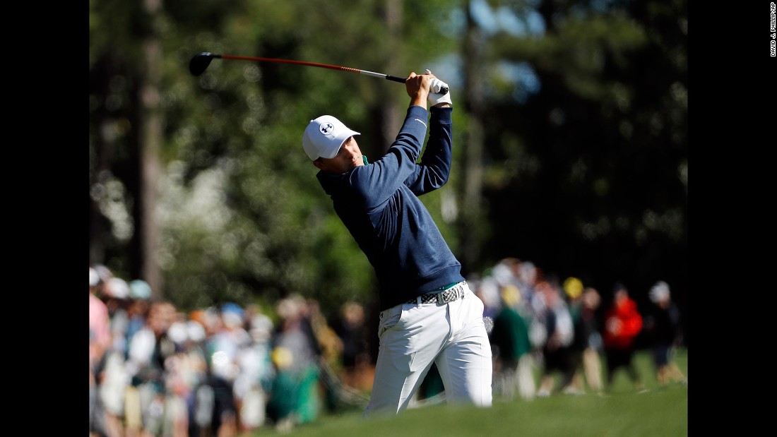 Spieth hits a shot during the first round on Thursday, April 7. Spieth shot a 6-under 66 to lead the tournament by two strokes heading into Friday.