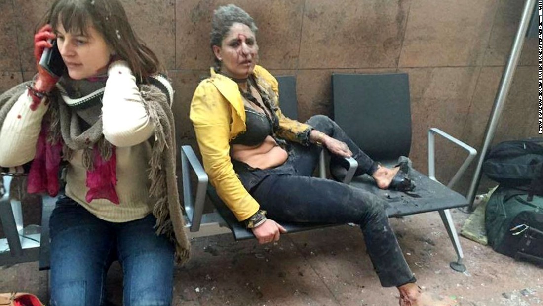 Two wounded women sit in the airport in Brussels, Belgium, after two explosions rocked the facility on March 22, 2016. A subway station in the city &lt;a href=&quot;http://www.cnn.com/2016/03/24/europe/brussels-investigation/index.html&quot; target=&quot;_blank&quot;&gt;was also targeted in terrorist attacks&lt;/a&gt; that killed at least 30 people and injured hundreds more. Investigators say the suspects belonged to the same ISIS network that was behind the Paris terror attacks in November.