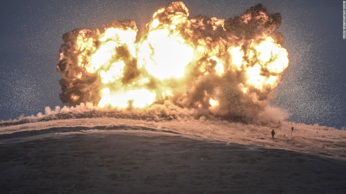 ISIS militants stand near the site of an airstrike near the Turkey-Syria border on October 23, 2014. The United States and several Arab nations &lt;a href=&quot;http://www.cnn.com/2014/09/22/world/meast/u-s-airstrikes-isis-syria/&quot; target=&quot;_blank&quot;&gt;began bombing ISIS targets in Syria&lt;/a&gt; to take out the group&#39;s ability to command, train and resupply its fighters.