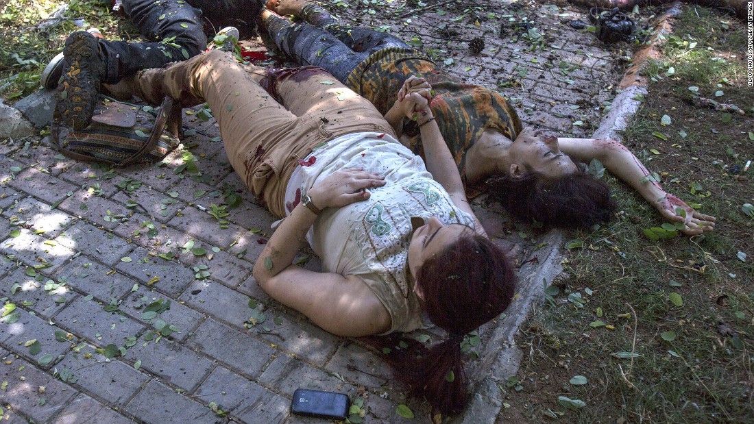 Two women hold hands after an explosion in Suruc, Turkey, on July 20, 2015. The blast &lt;a href=&quot;http://www.cnn.com/2015/07/22/world/turkey-suruc-explosion/index.html&quot; target=&quot;_blank&quot;&gt;occurred at the Amara Cultural Park,&lt;/a&gt; where a group was calling for help to rebuild the Syrian city of Kobani, CNN Turk reported. At least 32 people were killed and at least 100 were wounded in the bombing. Turkish authorities said they believed ISIS was involved in the explosion.