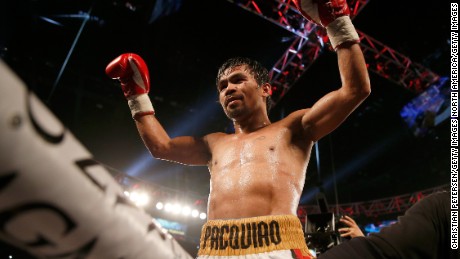 Manny Pacquiao celebrates after defeating Timothy Bradley Jr. by unanimous decision in their welterweight championship fight on April 9, 2016 at MGM Grand Garden Arena in Las Vegas, Nevada. 