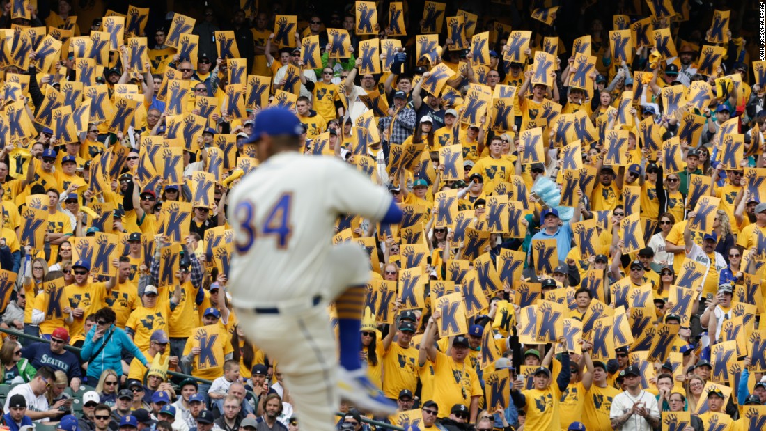 Seattle baseball fans hold up signs for pitcher Felix Hernandez as he winds up for a pitch on Sunday, April 10. The &quot;K&quot; stands for strikeout in baseball terminology.