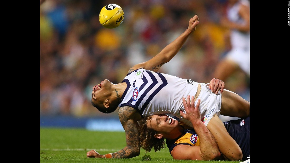 Matt Priddis of the West Coast Eagles tackles Michael Walters of the Fremantle Dockers during an Australian Football League match in Perth on Saturday, April 9.