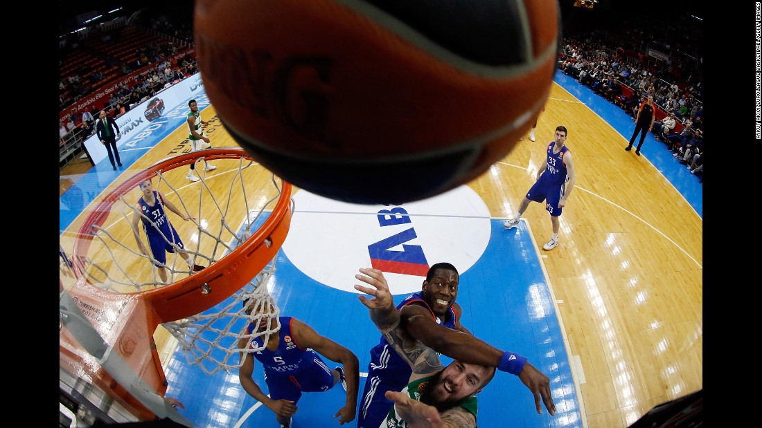 Panathinaikos&#39; Miroslav Raduljica, bottom, competes against Bryant Dunston, a player from Anadolu Efes, during a Euroleague game in Istanbul on Thursday, April 7.