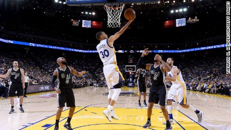 Curry, seen here April 7 against the Spurs at Oracle Arena in Oakland, California, leads the NBA in scoring with 29.9 points per game.