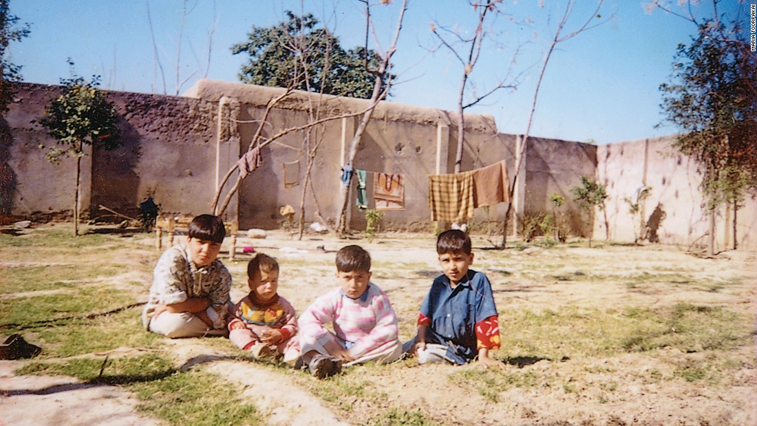 Sitting in the dirt in Darra Adam Khel. Maria is the &quot;boy&quot; on the far left -- she called herself &quot;Changez Khan&quot; to compete as a male in weightlifting.
