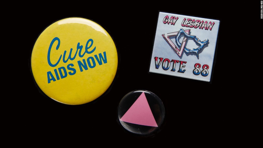 The AIDS epidemic moved many people out of the closet and into the streets to fight for greater acceptance. Pins were an easy way to signal support. The pink triangle honored LGBT victims of the Holocaust and was a &quot;reminder of the Holocaust perpetrated by our governments refusing to deal with AIDS,&quot; said &lt;a href=&quot;https://books.google.com/books?id=d5_rAgAAQBAJ&amp;pg=PA585&amp;lpg=PA585&amp;dq=the+time+is+not+right+to+march+on+washington+cathy+woolard&amp;source=bl&amp;ots=9SqK4h_lMo&amp;sig=bEE1unMopqyn6ibfXFN1eyJxKDk&amp;hl=en&amp;sa=X&amp;ved=0ahUKEwiigpGkrvjLAhXLQyYKHZgbAc0Q6AEIHDAA#v=onepage&amp;q=the%20time%20is%20not%20right%20to%20march%20on%20washington%20cathy%20woolard&amp;f=false&quot; target=&quot;_blank&quot;&gt;Cathy Woolard in 1989.&lt;/a&gt; Woolard, an Atlanta LGBT organizer, went on to be the Atlanta City Council&#39;s first female president. The buttons belonged to &lt;a href=&quot;http://emorymedicinemagazine.emory.edu/issues/2015/fall/features/aging-with-hiv/index.html#RHODES&quot; target=&quot;_blank&quot;&gt;Richard Rhodes&lt;/a&gt;, a Navy veteran and community organizer who became the first known gay candidate to run for the Georgia House in 1988, and was the first known gay delegate to the Democratic National Convention from Georgia. Every year on his birthday he would get an HIV test. AT 65, he tested HIV-positive. He remains an activist and an advocate for HIV testing. 