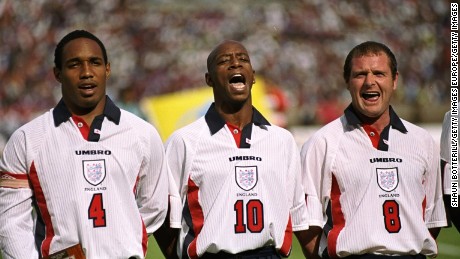 Wright belts out the national anthem alongside Paul Gascoigne and Paul Ince.