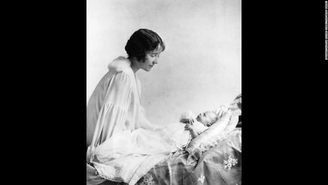 The Duchess of York looks lovingly at her first child, Princess Elizabeth, in May 1926.
