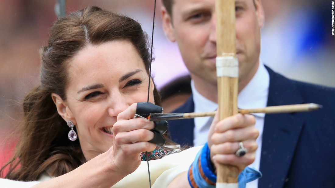 Prince William watches as his wife fires an arrow during an archery demonstration in Paro, Bhutan, on April 14.