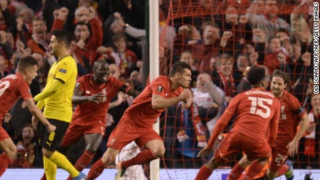 Dejan Lovren celebrates after scoring a late winning goal for Liverpool.