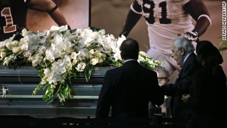 New Orleans Saints owner Tom Benson and his wife Gayle Benson view the casket of former Saints defensive end Will Smith during a public viewing inside the team&#39;s NFL football training facility in Metairie, Louisiana, Friday, April 15.