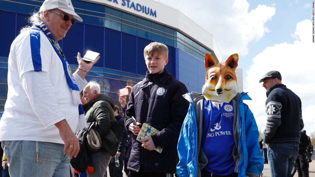 A young fan wears a fox mask outside the stadium before kick off of the English Premier League football match between Leicester City and West Ham United at King Power Stadium in Leicester.