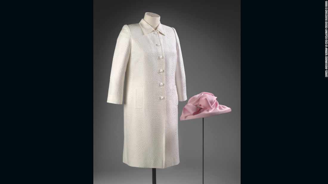Pink silk dress with white jacquard coat designed by Stewart Parvin, and pink hat by Philip Somerville, worn to a garden party.