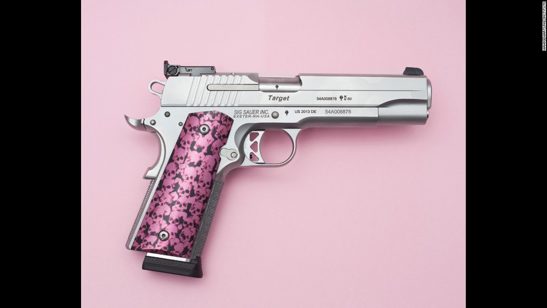 Photographers Miguel Hahn and Jan-Christophe Hartung were surprised by the scale of gun ownership in the country. So they set out to document it. The pistol pictured here is owned by a young woman. 