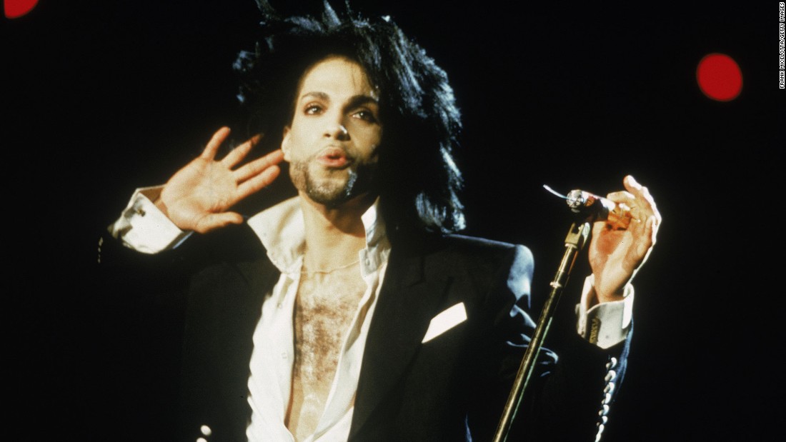 Prince listens to the crowd during a 1991 concert.