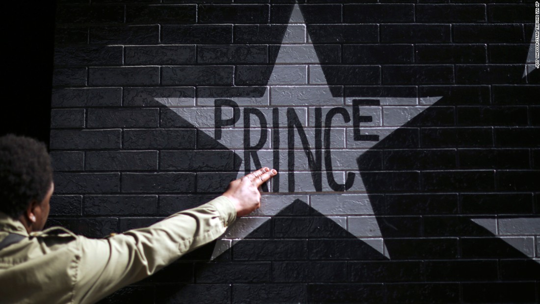 After kissing his fingers, a fan touches Prince&#39;s star on the wall of First Avenue and 7th St. Entry in Minneapolis, Minnesota, on April 21. The legendary musician died at his home in Minnesota at the age of 57.