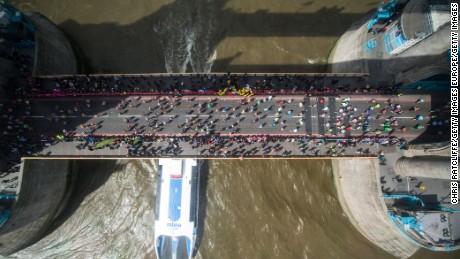 Runners cross the River Thames over Tower Bridge during the London Marathon on Sunday, April 24.